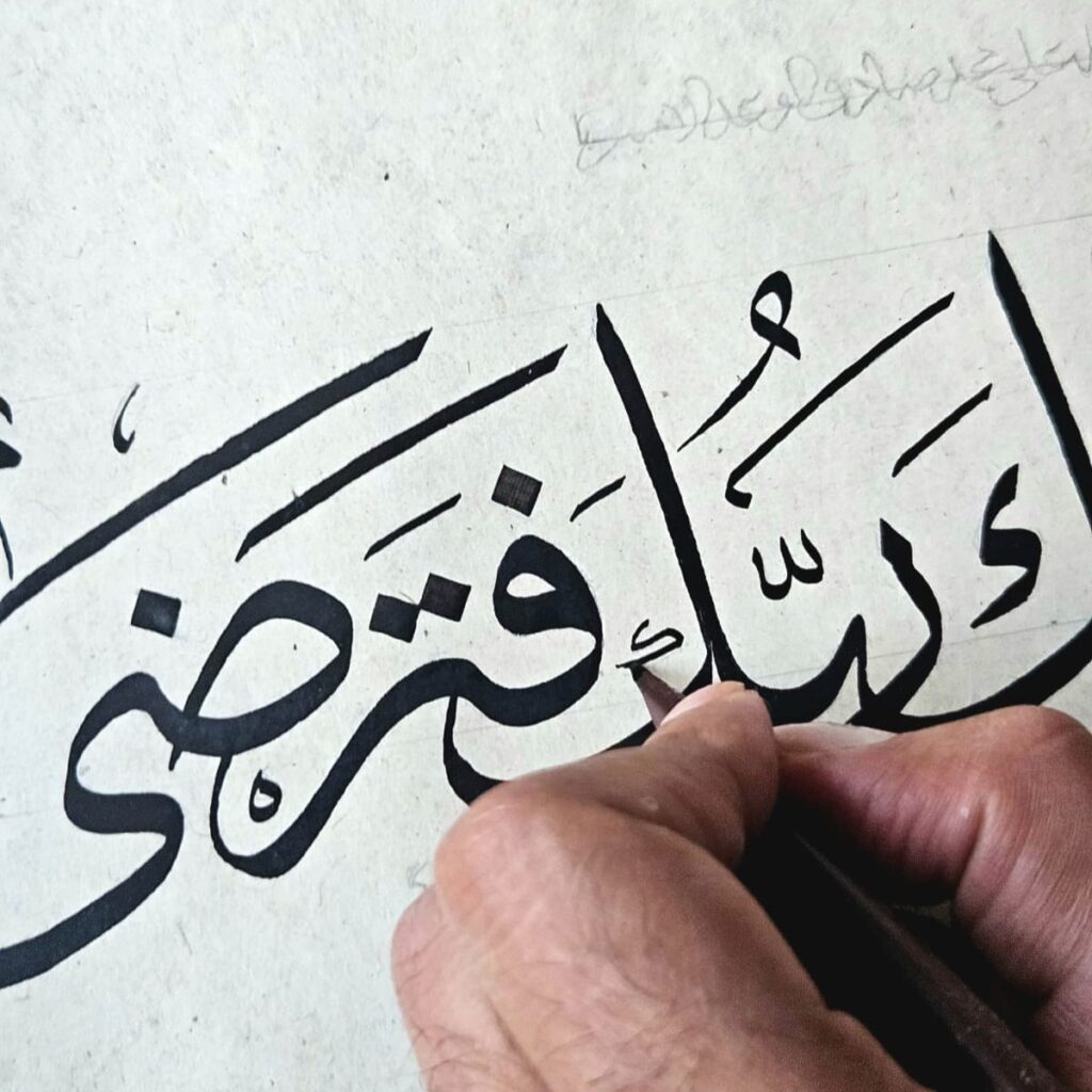 Rizwan Khan writing Thuluth with a reed qalam over pencil guidelines