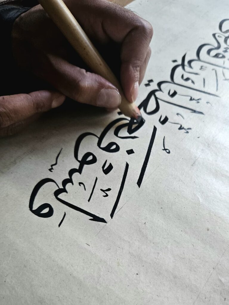 Rizwan Khan writing Thuluth calligraphy with a reed qalam